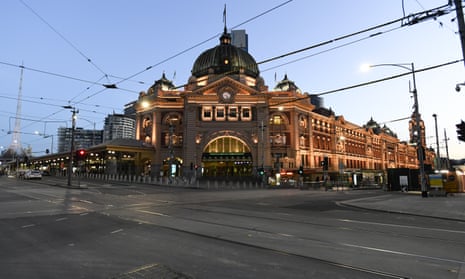 empty streets at the crossroads of Melbourne's usually busy Flinders street station