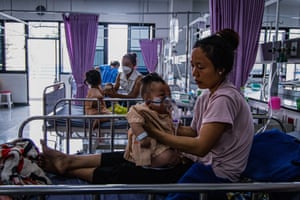 A displaced child from Myanmar’s Karen minority, pictured wth her mother, receives treatment at Tha Song Yang hospital in Thailand’s Tak state. After the USAid announcement, the International Rescue Committee (IRC), which had been the main healthcare provider in the refugee camps, was forced to shut down its clinics.