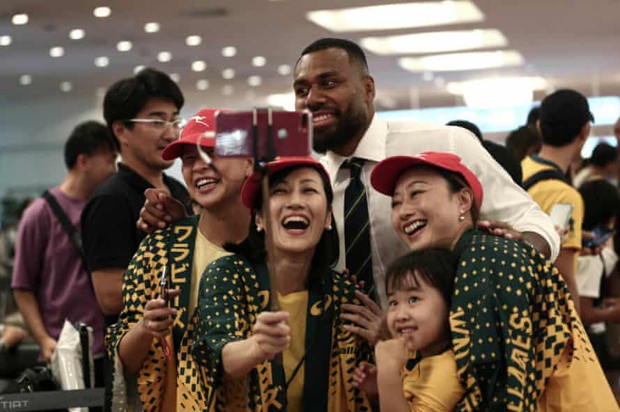 Australia’s Samu Kerevi poses for a selfie with Wallabies fans after the team’s arrival at Haneda airport in Tokyo.