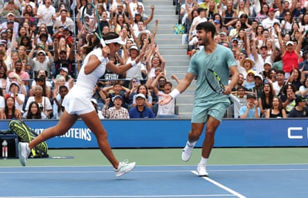 Emma Raducanu and Carlos Alcaraz observe a constituent during their mixed doubles lucifer against Jessica Pegula and Jack Draper of Britain astatine nan US Open.