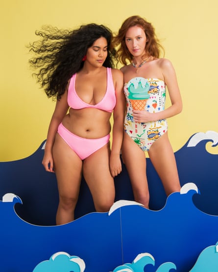 Woman in a pink bikini and woman in a strapless patterned swimsuit.