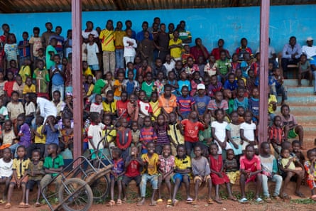 Muslim and Christian communities in Boda watch a football match