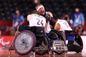 Aaron Phipps of Team Great Britain celebrates with teammate Ryan Cowling, No24, after defeating the United States during the gold medal wheelchair rugby match at the Tokyo 2020 Paralympic Games.