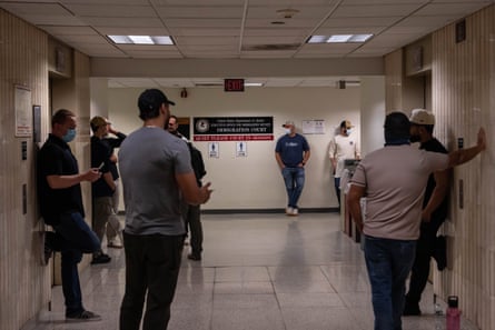 people standing in a hallway