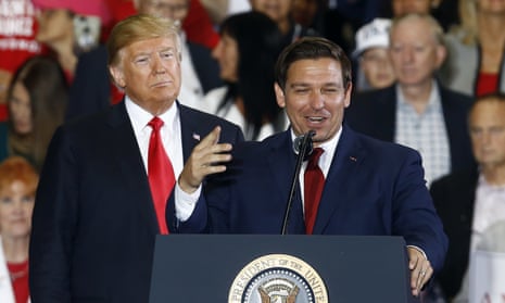 Donald Trump stands behind Ron DeSantis at a rally in Florida in 2018.