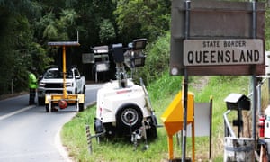 A car is stopped at Tomewin, on the Queensland-New South Wales border