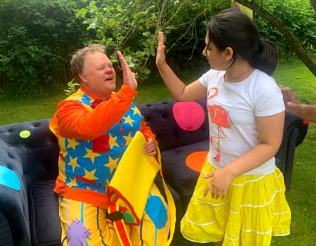 The writer's child Moly high-fiving Mr Tumble