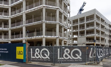 Half-built flats surrounded at their base by an L&Q banner