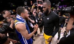 The Lakers’ LeBron James, right, and the Warriors’ Stephen Curry embrace after Friday night’s Game 6 of their Western Conference semi-final tie.