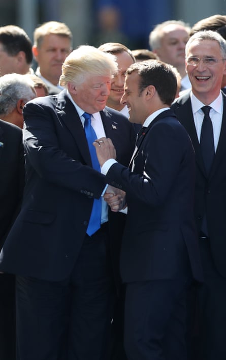 two men in suits shaking hands