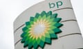 the green and yellow BP logo atop a petrol station forecourt stand