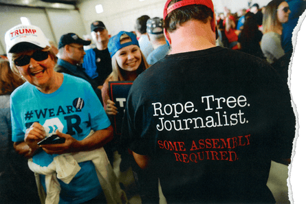 a man wearing a t shirt reading 'rope. tree. journalist.'