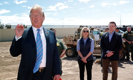 Donald Trump speaks in Calexico, California, while the then homeland security secretary, Kirstjen Nielsen, watches flanked by her acting successor, Kevin McAleenan.