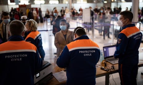 Passengers arriving at Charles de Gaulle airport in Paris, France. People arriving from the UK will have to quarantine.