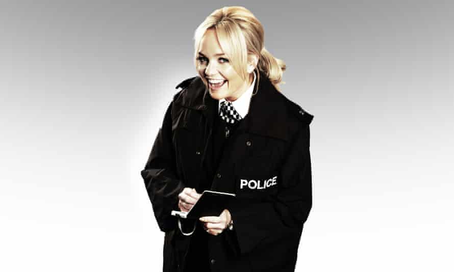 Emma Bunton as Emma Bunton in a police uniform.
