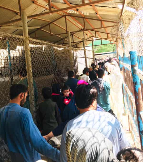 Afghan players and their families at the border with Pakistan