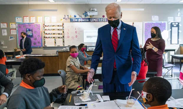 Joe Biden at Brookland middle school in Washington on Friday. Biden’s move comes against a backdrop of vaccination rates that have stalled.