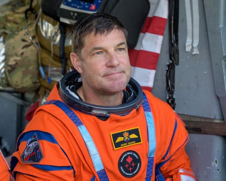 Jeremy Hansen sitting in a US Navy helicopter on the flight deck of USS John P. Murtha after he and three fellow crewmates were extracted from their Artemis II mission's Orion spacecraft on 10 April.