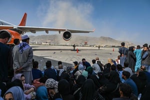 People wait at Kabul airport