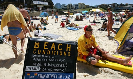 A sign warns bathers of the extreme heat on Bondi Beach, in Sydney, Australia.