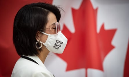 Linda Li, president of the Tri-City Chinese Community Society, wears a face mask that says ‘Stop Asian hate’ in Richmond.