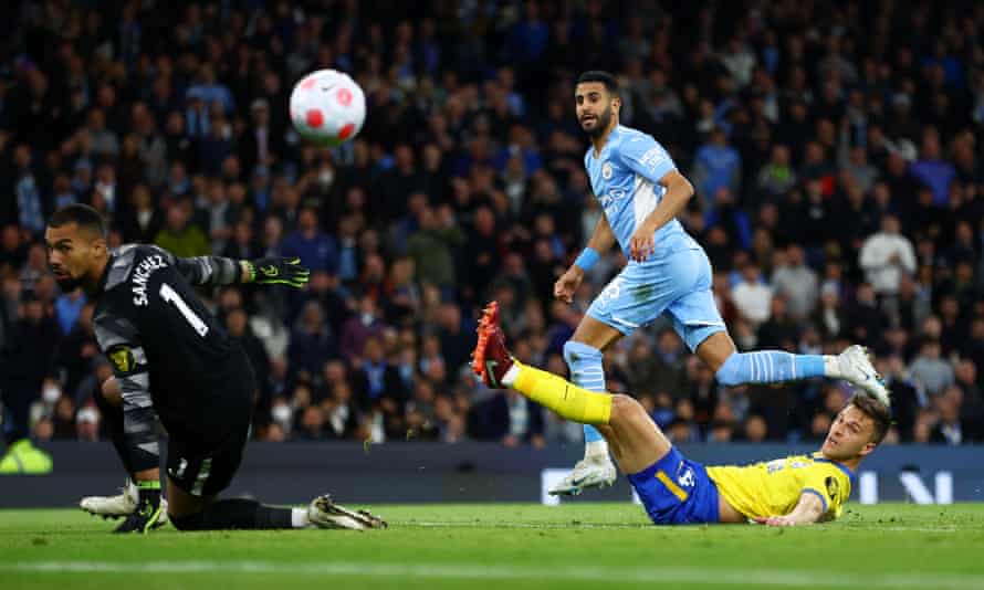 Manchester City’s Riyad Mahrez scores their first goal.