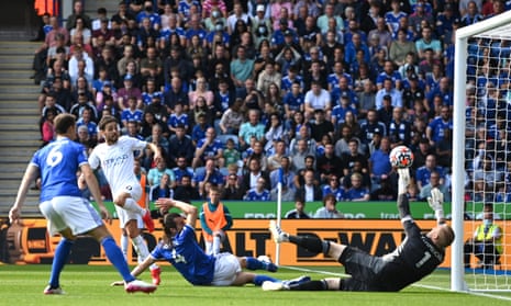 Bernardo Silva scores Manchester City’s first goal past Leicester City keeper Kasper Schmeichel.