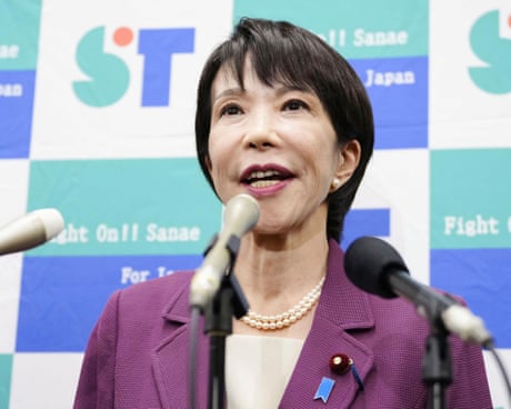 Sanae Takaichi wearing a pearl necklace and purple blazer