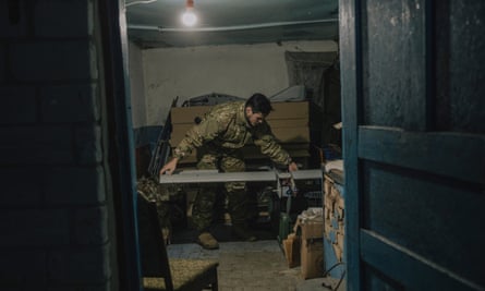 Oleksandr Ivantsov reassembles a drone in the warehouse where it is kept together with other tools.