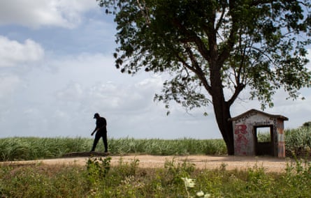 Silhouette of a man in the distance in a rural landscape of Monte Coca, Dominican Republic.