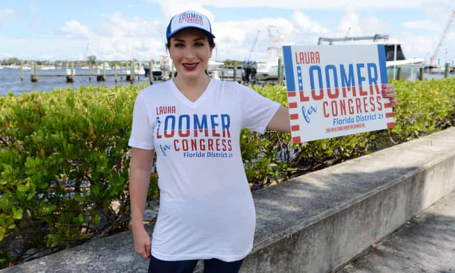 Laura Loomer campaigns as boaters are seen on the intercostal waterways at Mar-a-Lago in a Trump flotilla in June.