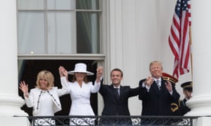 Brigitte Macron, Melania Trump, Emmanuel Macron and Donald Trump wave from the White House balcony.