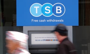 A man uses a TSB cash machine in Ashford, Kent