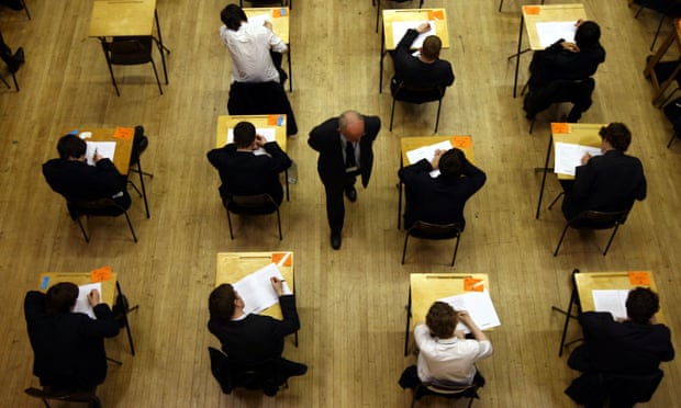 pupils sitting an exam, as teenagers in London score higher GCSE results 