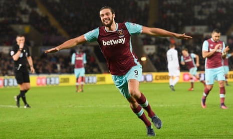 Andy Carroll wheels away in delight after scoring West Ham’s fourth goal against Swansea to confirm a third Premier League win in a row for Slaven Bilic’s side.
