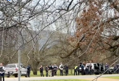 Police gather at the site of the unfolding incident at Porepunkah