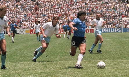 Maradona runs past Terry Butcher, left, and Terry Fenwick, second left, on his way to scoring his second goal against England in 1986. It is regarded as being one of the greatest goals of all time