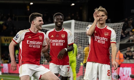Arsenal's Martin Odegaard celebrates scoring his side's second goal with teammates Declan Rice and Bukayo Saka.