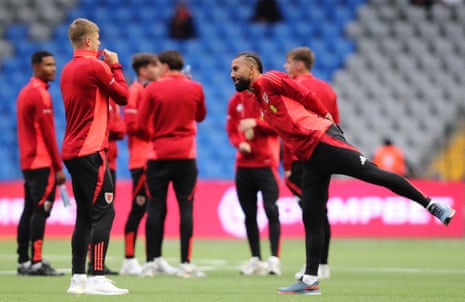 Cymru’s players stroll on the artificial pitch upon arrival at the Astana Arena.