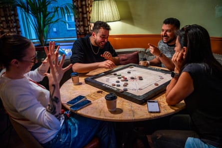 Ala El-Kurd, in the black shirt, plays with Rahima Valij, wearing a dark green cardigan.