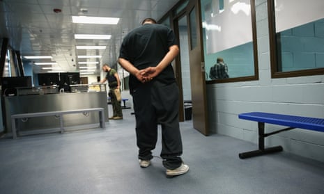 An immigrant walks in chains through a US Immigration and Customs Enforcement (ICE), processing center in Camarillo, California.