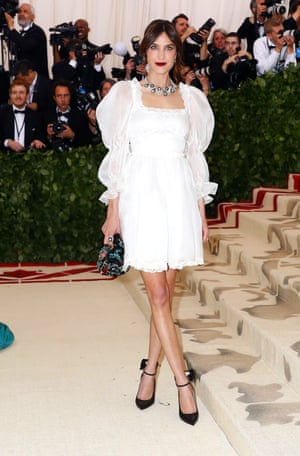 Alexa Chung chose an angelic ensemble of her own design. As with many guests who chose an ethereal hue, she countered her outfit with bold makeup