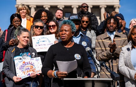 a man in front of a microphone