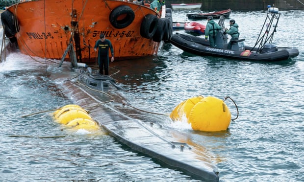 Spanish Guardia Civil refloating the submarine.
