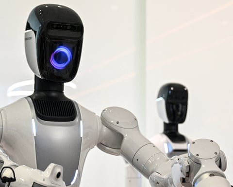 Two humanoid robots trained to do household tasks at a facility in China