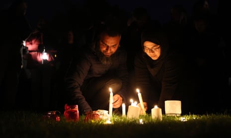 Members of the public light candles in memory of MP Sir David Amess at Belfairs Sports Ground in Leigh-on-Sea, Essex.