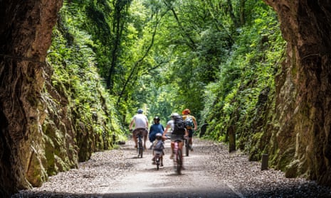 A family cycles on the Strawberry Line near Axbridge in Somerset.