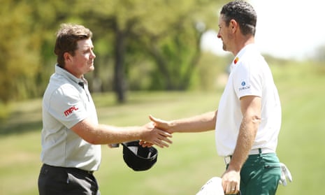 Eddie Pepperell (left) and Justin Rose shake hands on the 18th green after halving their match during the second round of theWGC Match Play in Austin, Texas. 