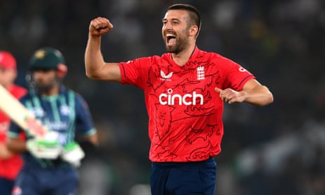 England’s Mark Wood celebrates taking the wicket of Babar Azam of Pakistan