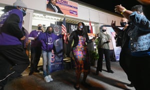 Cori Bush dances with supporters during her election night watch party at campaign headquarters in St Louis, Missouri